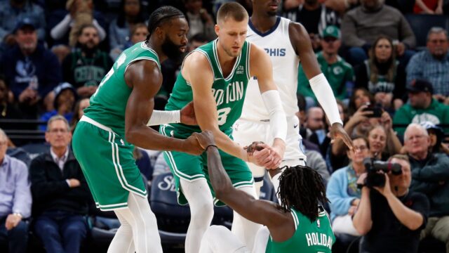 Boston Celtics guard Jaylen Brown, center Kristaps Porzingis, Portland Trail Blazers guard Jrue Holiday