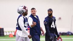 New England Patriots head coach Mike Vrabel, defensive end Keion White, linebacker K'Lavon Chaisson