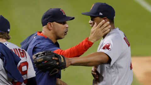 Boston Red Sox manager Alex Cora and Rafael Devers