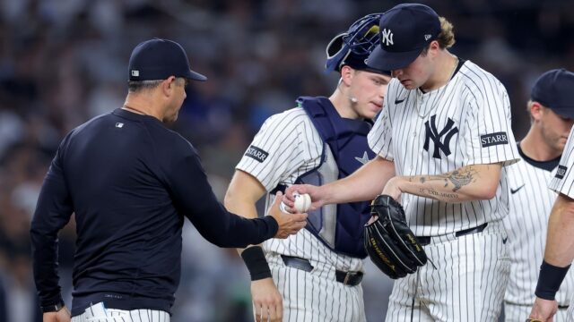 New York Yankees manager Aaron Boone and starting pitcher Cam Schlittler