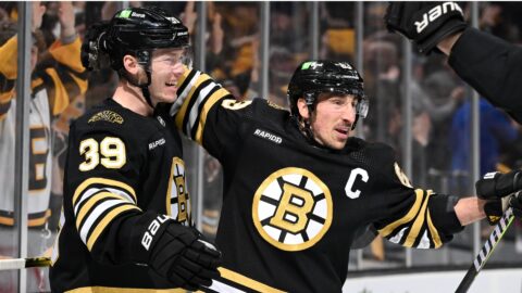 Boston Bruins forwards Morgan Geekie and Brad Marchand