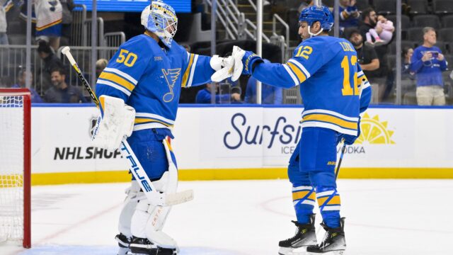St. Louis Blues goaltender Jordan Binnington and left wing Milan Lucic