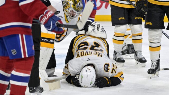 Boston Bruins goalie Jeremy Swayman and defenseman Charlie McAvoy