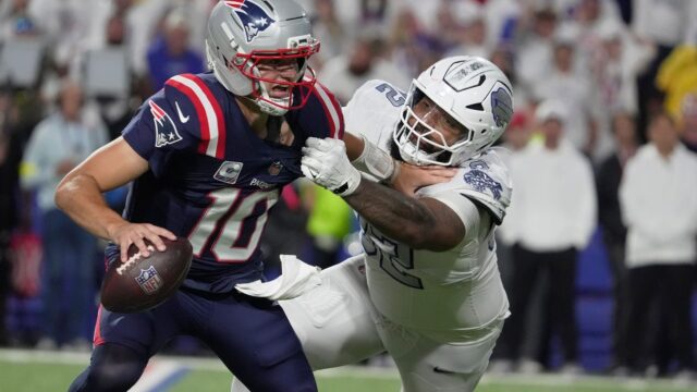 Buffalo Bills defensive tackle Daquan Jones and New England Patriots quarterback Drake Maye