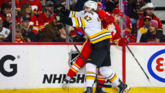 Boston Bruins forward Mark Kastelic, Calgary Flames defenseman Joel Hanley