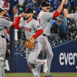 Boston Red Sox third baseman Alex Bregman, catcher Carlos Narvaez, pitcher Payton Tolle and first baseman Nathaniel Lowe
