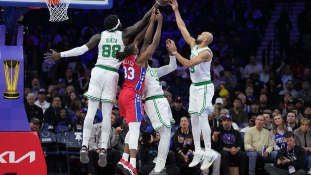 Boston Celtics center Neemias Queta, forward Jaylen Brown and guard Derrick White and Philadelphia 76ers forward Jabari Walker