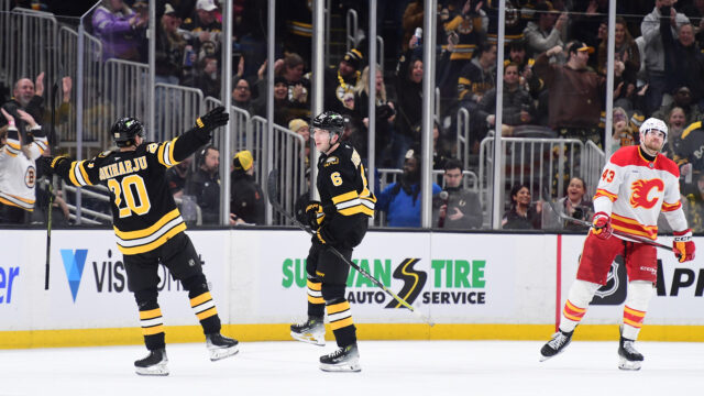 Boston Bruins defensemen Mason Lohrei, Henri Jokiharju